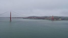 6K aerial stock footage of flying by the Golden Gate Bridge on a foggy day, San Francisco, California Aerial Stock Footage | AX0175_0029