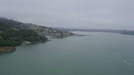 6K aerial stock footage flyby cliffs to reveal Sausalito on a foggy day, California Aerial Stock Footage | AX0175_0032