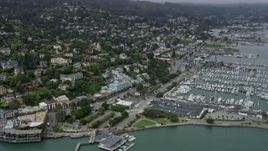6K aerial stock footage of homes overlooking marinas in Sausalito on a foggy day, California Aerial Stock Footage | AX0175_0034
