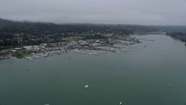 6K aerial stock footage of approaching marinas by coastal neighborhoods in Sausalito on a foggy day, California Aerial Stock Footage | AX0175_0036