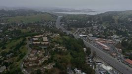 6K aerial stock footage of Highway 101 through Mill Valley on a foggy day, California Aerial Stock Footage | AX0175_0039