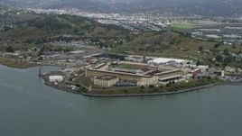 6K aerial stock footage of a view of San Quentin State Prison from the water, California Aerial Stock Footage | AX0175_0047