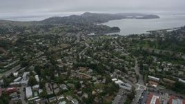 6K aerial stock footage flyby suburban neighborhoods in Mill Valley on a foggy day, California Aerial Stock Footage | AX0175_0060