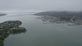 6K aerial stock footage tilt from Mill Valley to reveal Sausalito on a foggy day, California Aerial Stock Footage | AX0175_0062