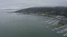 6K aerial stock footage of flying by Sausalito neighborhoods and marinas on a foggy day, California Aerial Stock Footage | AX0175_0063