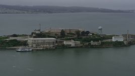 6K aerial stock footage of orbiting Alcatraz on a foggy day, California Aerial Stock Footage | AX0175_0069