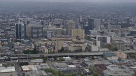 6K aerial stock footage of approaching Downtown Oakland on a foggy day, California Aerial Stock Footage | AX0175_0082