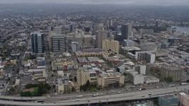 6K aerial stock footage of Downtown Oakland office buildings on a foggy day, California Aerial Stock Footage | AX0175_0083