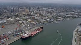 6K aerial stock footage approach Downtown Oakland from the port on a foggy day, California Aerial Stock Footage | AX0175_0085