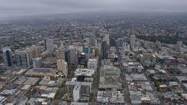6K aerial stock footage passing office buildings in Downtown Oakland on a foggy day, California Aerial Stock Footage | AX0175_0087