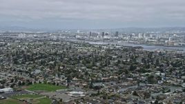 6K aerial stock footage of Downtown Oakland seen from suburbs in Alameda, California Aerial Stock Footage | AX0175_0097