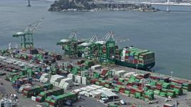 6K aerial stock footage of a ship loaded with containers at the Port of Oakland, California Aerial Stock Footage | AX0175_0102