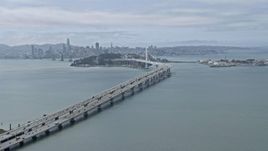 6K aerial stock footage tilting up for a view of the Bay Bridge, California Aerial Stock Footage | AX0175_0103