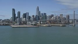6K aerial stock footage tilt from the bay to reveal and approach Downtown San Francisco skyline, California Aerial Stock Footage | AX0175_0125