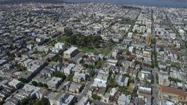 6K aerial stock footage of fly over urban neighborhoods to circle Alamo Square, Western Addition, San Francisco, California Aerial Stock Footage | AX0175_0139