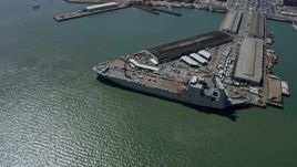 6K aerial stock footage of a Naval ship docked at Pier 50, San Francisco, California Aerial Stock Footage | AX0175_0147