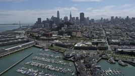 6K aerial stock footage tilt to reveal Pier 39, Coit Tower and Downtown San Francisco, California Aerial Stock Footage | AX0175_0154