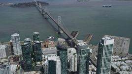 6K aerial stock footage of Downtown San Francisco and the nearby Bay Bridge, California Aerial Stock Footage | AX0175_0156