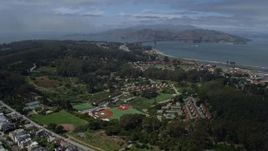 6K aerial stock footage tilt from Inner Richmond to reveal The Presidio and Golden Gate Bridge, San Francisco, California Aerial Stock Footage | AX0175_0161