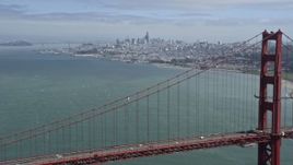 6K aerial stock footage flyby Golden Gate Bridge with view of distant Downtown San Francisco, California Aerial Stock Footage | AX0175_0169
