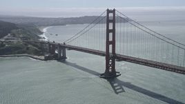 6K aerial stock footage flying by a tower on the Golden Gate Bridge, San Francisco, California Aerial Stock Footage | AX0175_0176