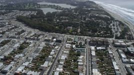 6K aerial stock footage of flying over Outer Sunset District homes, tilt to shops, San Francisco, California Aerial Stock Footage | AX0175_0186