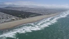 6K aerial stock footage of a reverse view of Golden Gate Park, Ocean Beach, and Outer Sunset, San Francisco, California Aerial Stock Footage | AX0175_0194