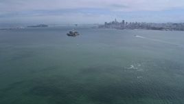 6K aerial stock footage approaching Alcatraz with view of Downtown San Francisco skyline, California Aerial Stock Footage | AX0175_0211