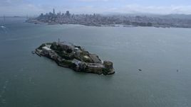 6K aerial stock footage approach and flyby Alcatraz with view of Downtown San Francisco skyline, California Aerial Stock Footage | AX0175_0212