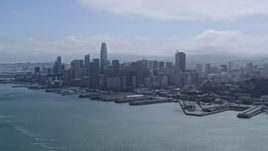 6K aerial stock footage of the Downtown San Francisco skyline seen while flying over the bay, California Aerial Stock Footage | AX0175_0213