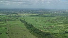 4.8K aerial stock footage Flying over grassland, Toa Baja, Puerto Rico Aerial Stock Footage | AX101_030