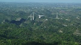 4.8K aerial stock footage of Arecibo Observatory nestled among the lush green Karst Forest, Puerto Rico Aerial Stock Footage | AX101_087