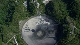 4.8K aerial stock footage Hovering above Arecibo Observatory and surrounding trees, Puerto Rico Aerial Stock Footage | AX101_120E