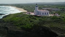 4.8K aerial stock footage orbiting and then approaching the Arecibo Lighthouse along the coast, Puerto Rico Aerial Stock Footage | AX101_148E