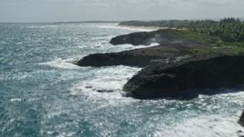 4.8K aerial stock footage of a domed rock formations in crystal blue waters along the coast, Arecibo, Puerto Rico Aerial Stock Footage | AX101_171E
