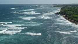 4.8K aerial stock footage of waves off of the coast in pristine blue water, Vega Baja, Puerto Rico Aerial Stock Footage | AX101_197E