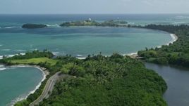 4.8K aerial stock footage of a highway following crystal blue Caribbean, revealing  Punta Salinas Radar Site, Dorado, Puerto Rico Aerial Stock Footage | AX101_226E