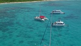 4.8K aerial stock footage of catamarans in tropical blue waters, Rada Fajardo, Puerto Rico Aerial Stock Footage | AX102_078E