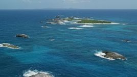 4.8K aerial stock footage of a tiny island in tropical blue waters, Puerto Rico Aerial Stock Footage | AX102_087E