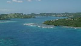 4.8K aerial stock footage of a hilltop home along sapphire blue waters, reveal coastal town, Culebra, Puerto Rico Aerial Stock Footage | AX102_138E