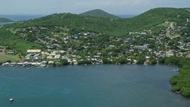 4.8K aerial stock footage of a factory in a coastal community, Culebra, Puerto Rico Aerial Stock Footage | AX102_143E
