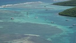 4.8K aerial stock footage of Sailboats docked in turquoise waters near the coast, Culebra, Puerto Rico  Aerial Stock Footage | AX102_169