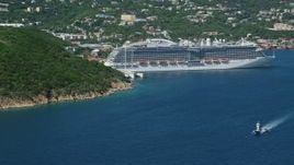 4.8K aerial stock footage of a Cruise ship docked in sapphire blue waters along a coastal town, Charlotte Amalie, St. Thomas  Aerial Stock Footage | AX102_200