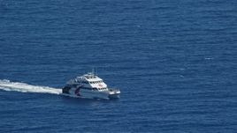 4.8K aerial stock footage of a Catamaran in blue ocean waters, Southside, St Thomas  Aerial Stock Footage | AX102_237
