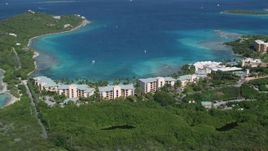 4.8K aerial stock footage of The Ritz-Carlton resort along turquoise blue waters, St Thomas, US Virgin Islands  Aerial Stock Footage | AX102_243