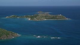 4.8K aerial stock footage of Little St James Island surrounded by sapphire waters, St Thomas, US Virgin Islands Aerial Stock Footage | AX102_248
