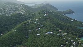 4.8K aerial stock footage of Hilltop homes over looking the blue ocean waters, East End, St Thomas  Aerial Stock Footage | AX102_259