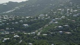 4.8K aerial stock footage of Hilltop homes among trees, East End, St Thomas  Aerial Stock Footage | AX102_260