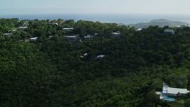 4.8K aerial stock footage of Hilltop oceanfront homes reveal Caribbean blue waters, Northside, Charlotte Amalie Aerial Stock Footage | AX102_291