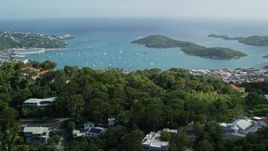 4.8K aerial stock footage Reveal coastal town along turquoise blue Caribbean waters, Charlotte Amalie, St Thomas  Aerial Stock Footage | AX102_292